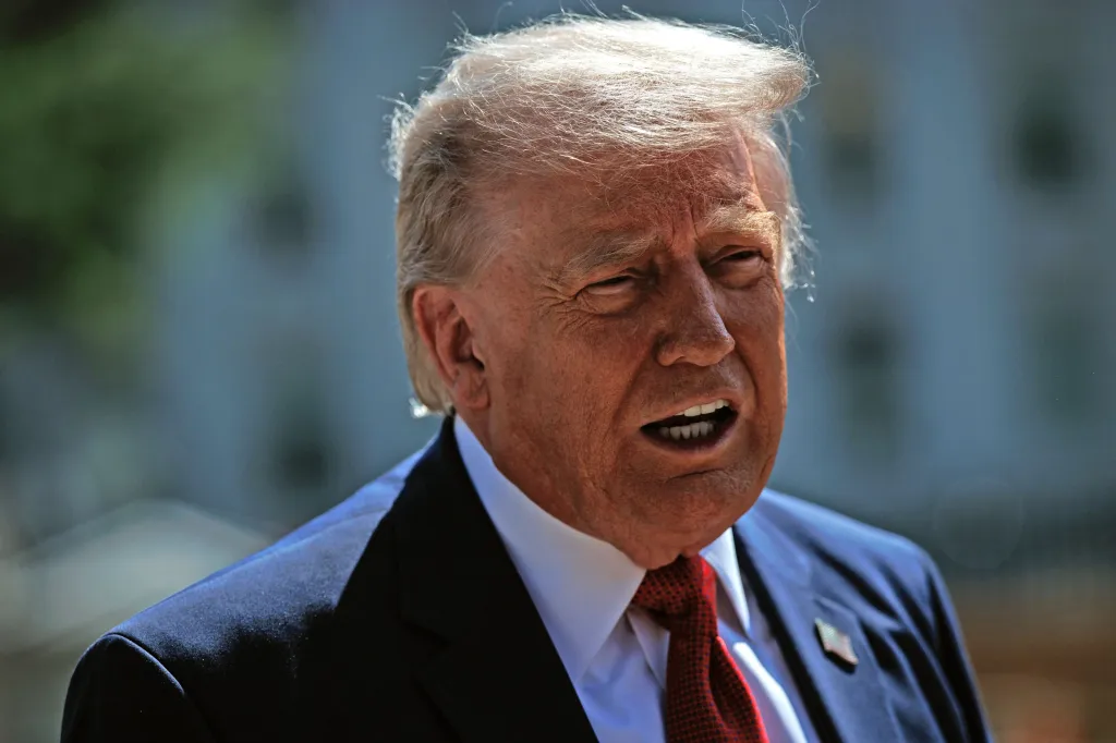 U.S. President Donald Trump speaks to the press about the new East Wing construction at the White House.