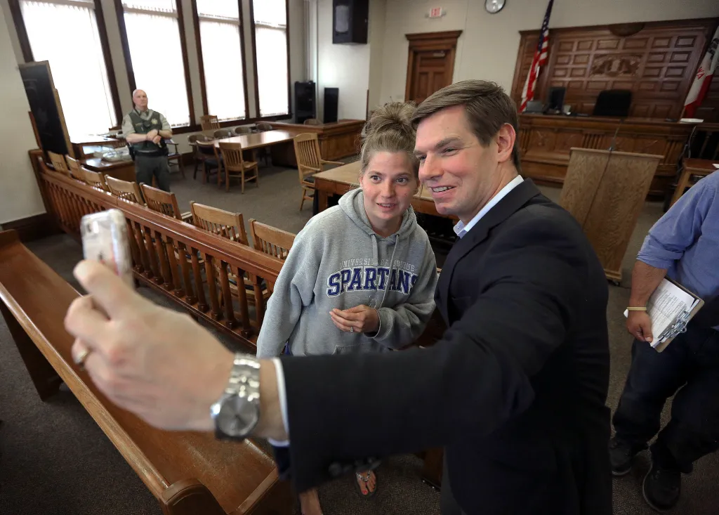 Eric Swalwell takes a selfie with University of Dubuque student Mariah Schumacher.
