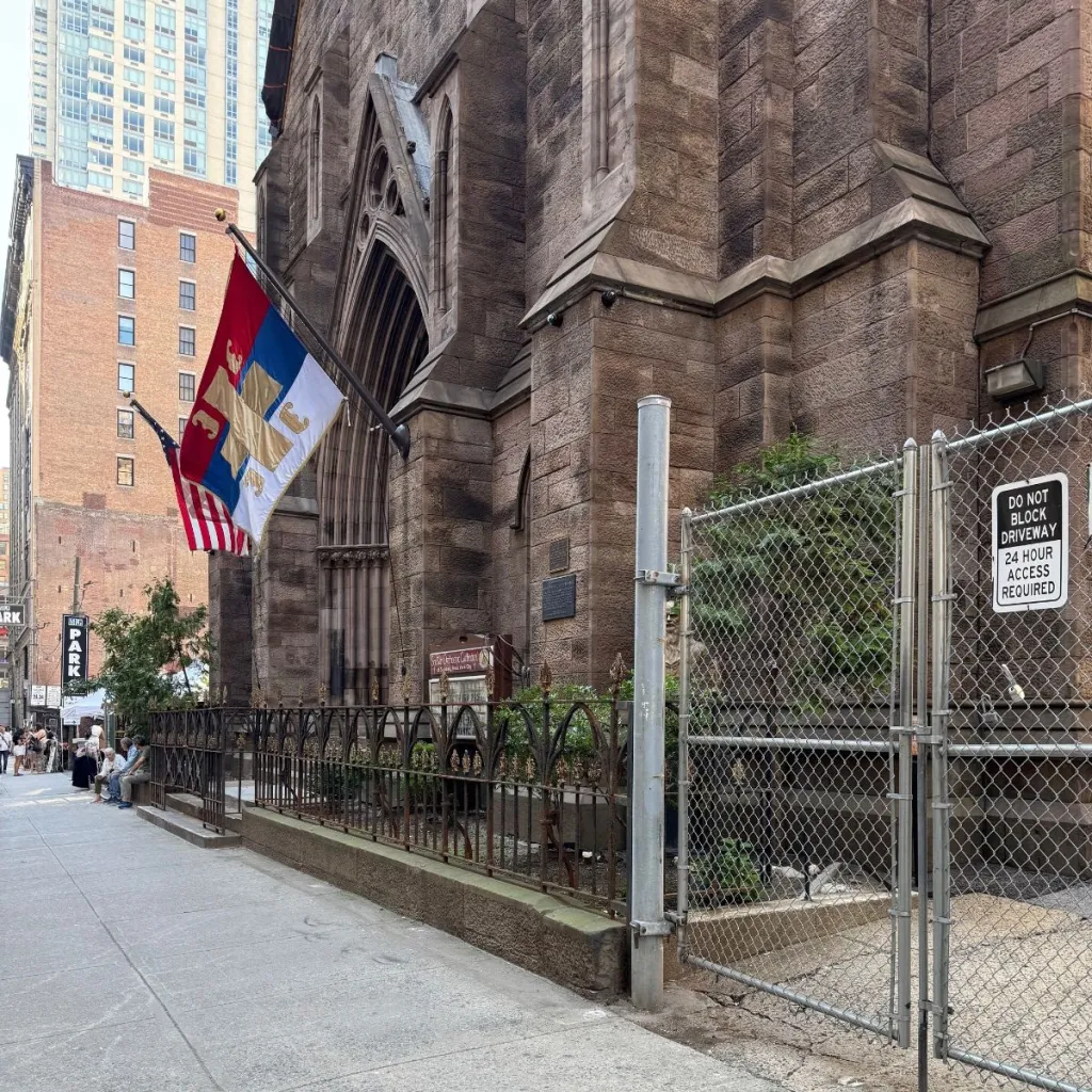 The Serbian Orthodox Cathedral of St. Sava with Serbian and US flags hanging outside.