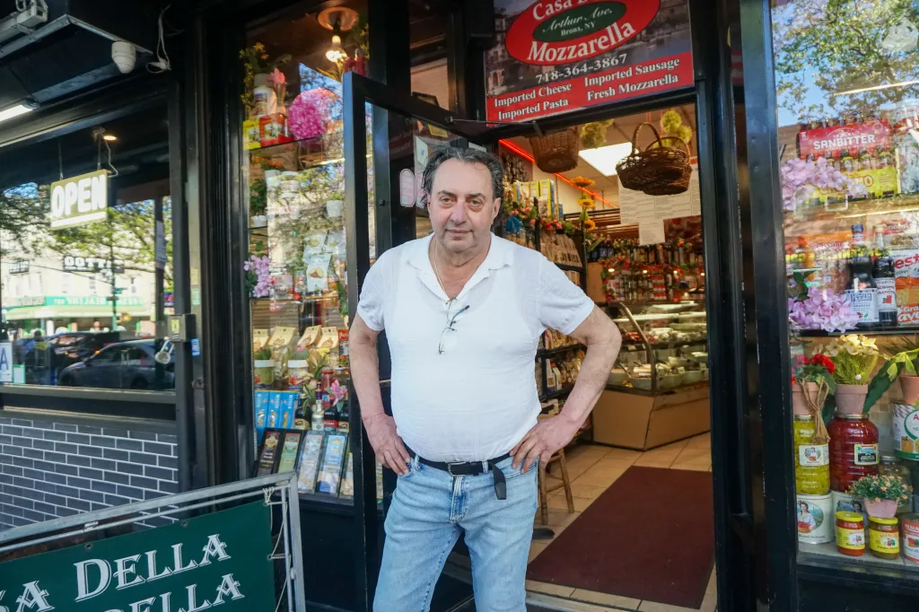 Orazio Carciotto, owner of Casa Della Mozzarella, stands in the doorway of his store.