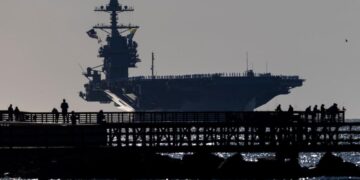 Aircraft carrier USS Ford returns home after 11-month deployment off Venezuela and Iran