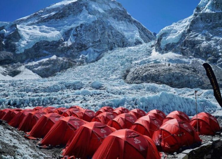 Mount Everest season opens late, with climbers undeterred by huge ice block and high travel costs