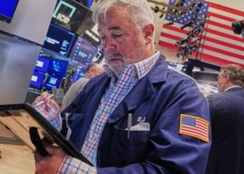 Tech carries Wall Street to records, even as most stocks fall after discouraging inflation data