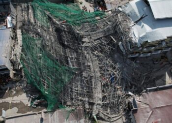 Building under construction in Philippines collapses, leaving 1 dead and 21 trapped