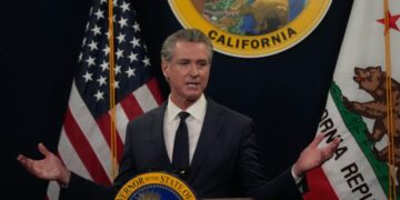 Immigrant rights advocates rally for more state healthcare funding, criticize Newsom