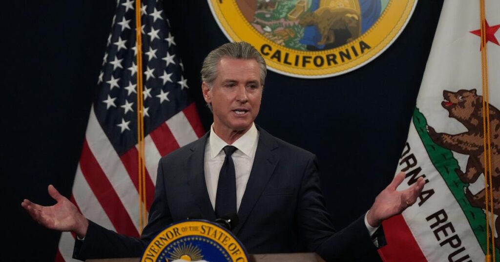 Immigrant rights advocates rally for more state healthcare funding, criticize Newsom