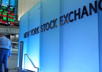 Stocks fall from their records as oil prices yo-yo