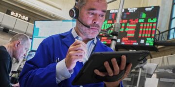 Stocks rise to records after a solid jobs report overshadows higher oil prices