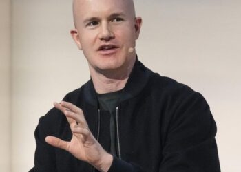 Crypto exchange Coinbase to lay off 14% of staff as AI reshapes work