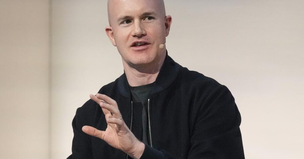 Crypto exchange Coinbase to lay off 14% of staff as AI reshapes work