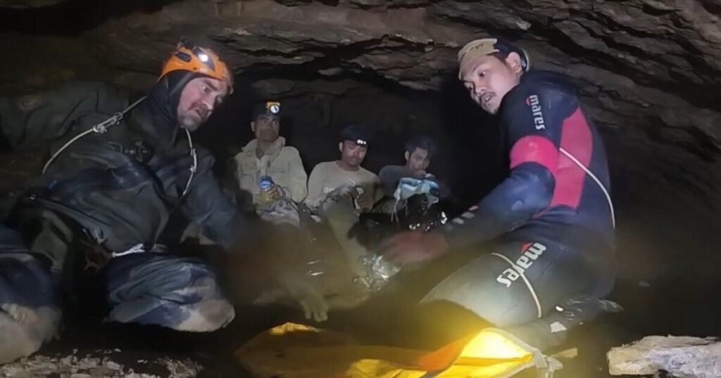 Rescuers free 4 men trapped in a flooded Laos cave; 2 still missing