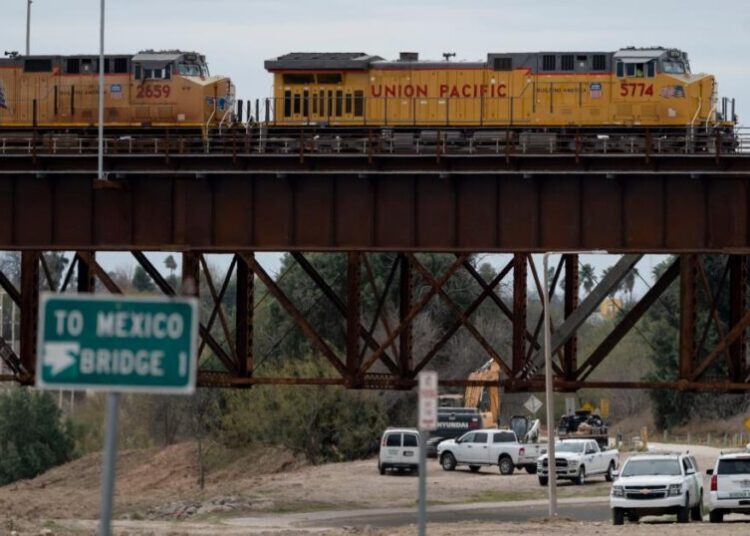 Heat stroke is suspected among 6 found dead in shipping container at a rail yard near Texas border