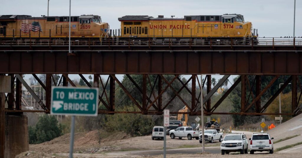 Heat stroke is suspected among 6 found dead in shipping container at a rail yard near Texas border