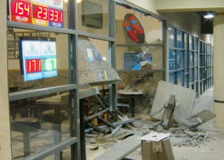 Doughnut shop was closed, so he drove into it, then tried to run over officer, police say