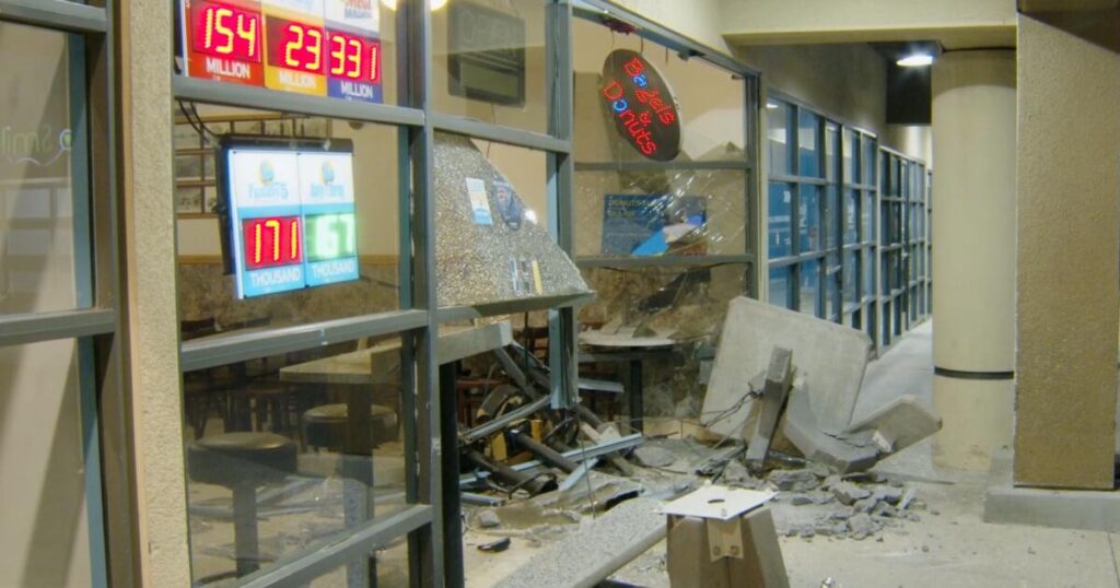 Doughnut shop was closed, so he drove into it, then tried to run over officer, police say