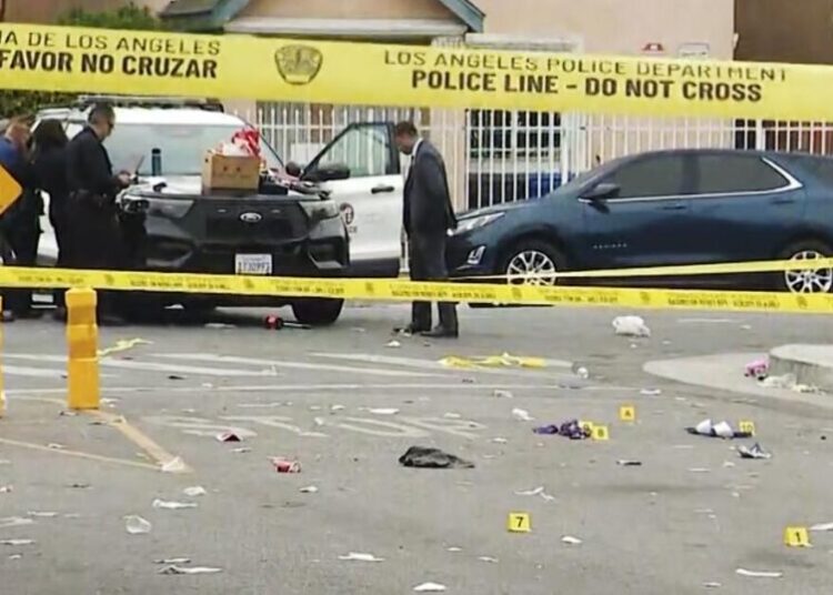 One woman killed, another wounded in overnight shooting near a vigil in Watts