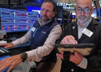 Stocks fall further from their records after bond markets crank up the pressure