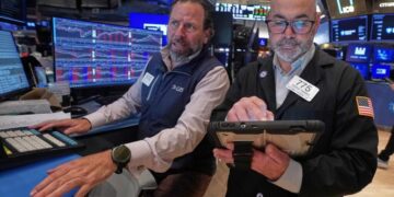 Stocks fall further from their records after bond markets crank up the pressure