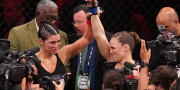 Ronda Rousey defeats Gina Carano in 17 seconds at a high-profile MMA event, retires