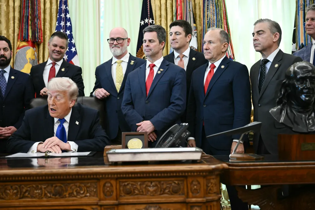 US President Donald Trump holds an event to sign executive orders in the Oval Office.