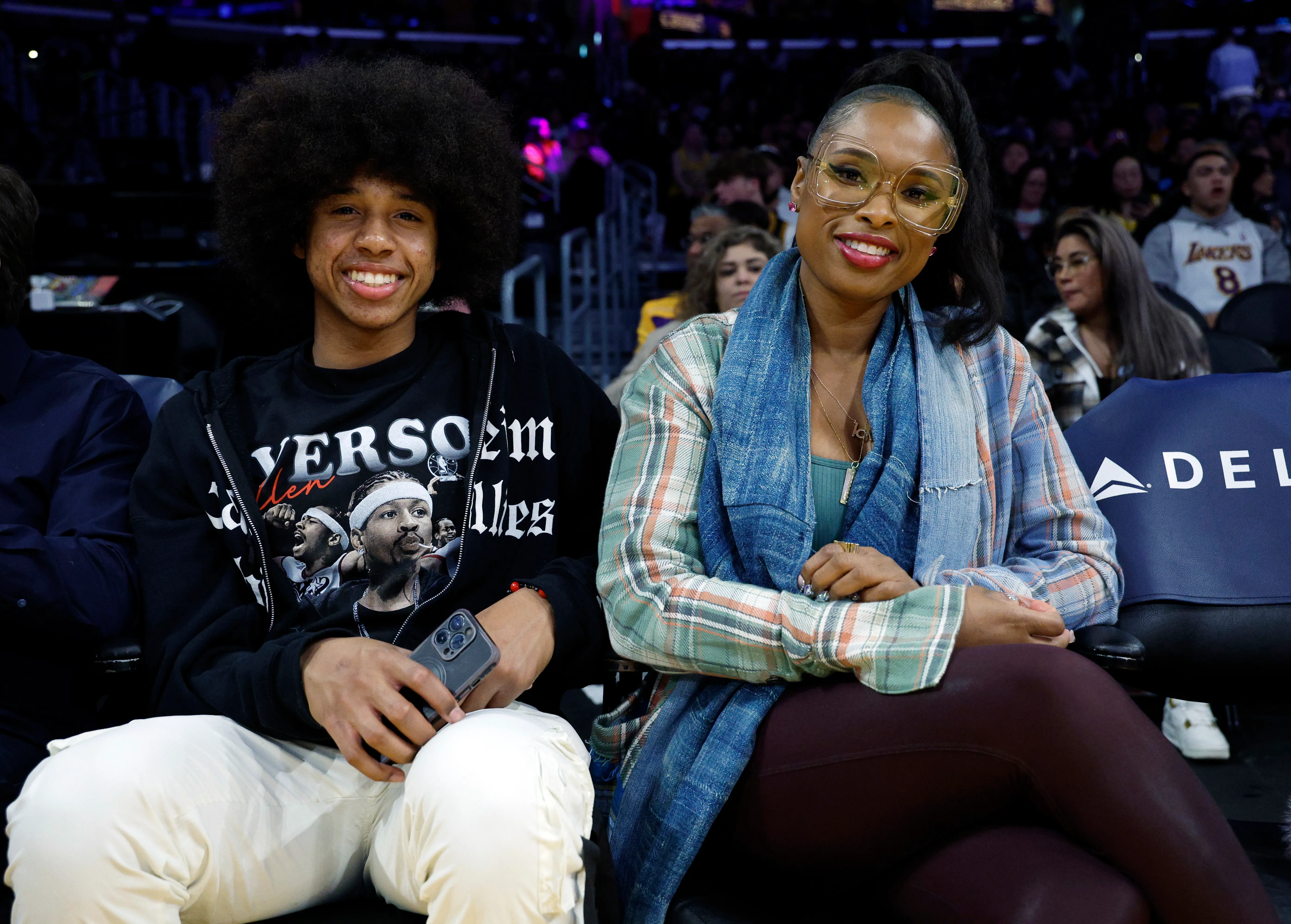 Jennifer Hudson and her son, David Daniel Otunga Jr., sit courtside at a Lakers basketball game.