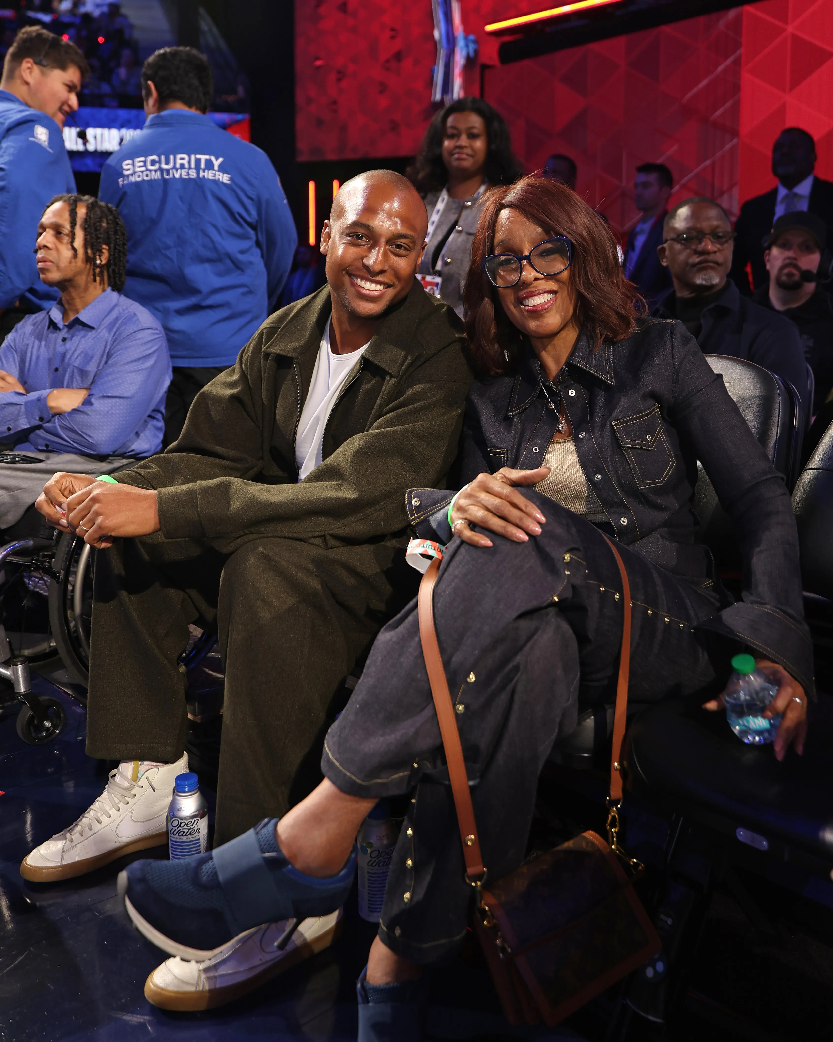 Gayle King and William Bumpus smiling for a photo during the NBA All-Star Game.