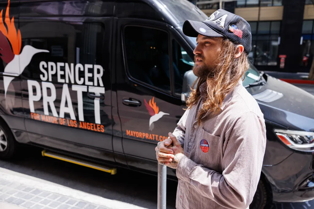 Van Arthur with long hair and a beard, wearing an 