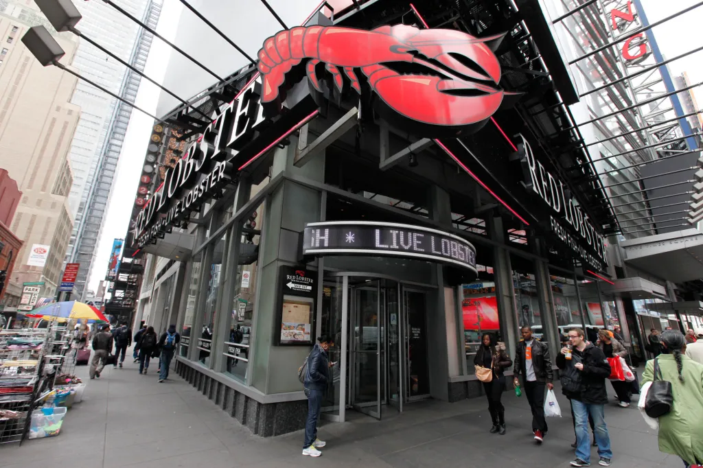 The Red Lobster restaurant in Times Square, New York City, featuring a large red lobster sign on its facade.