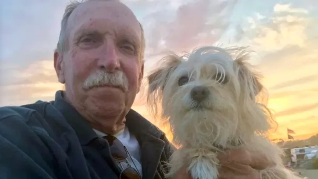 Ed Ashman, a veteran and teacher, with his dog at sunset.