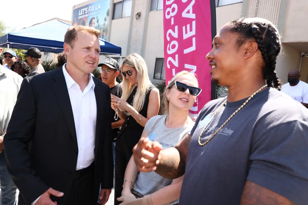 Victoriah and Jonathan Parker with LA Mayoral candidate Spencer Pratt at a block party in Los Angeles, California.