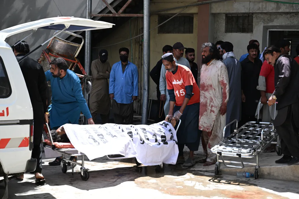 Volunteers transport a body of a victim at a hospital after an explosion targeted a train in Quetta on May 24, 2026.