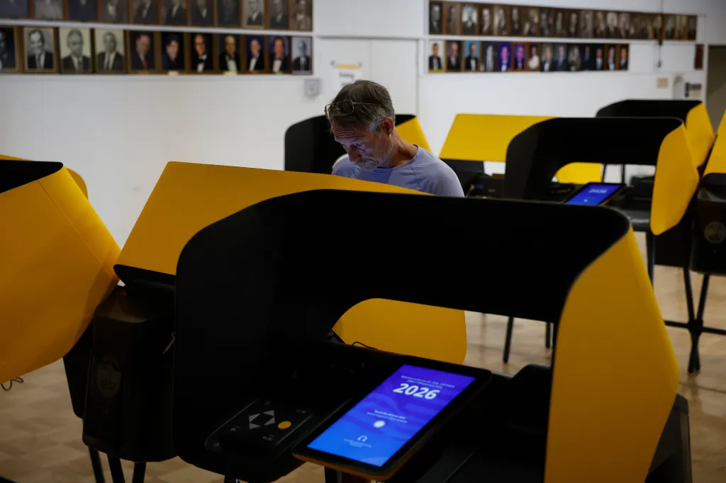 A man casting an early ballot on a digital voting machine in Los Angeles, California.