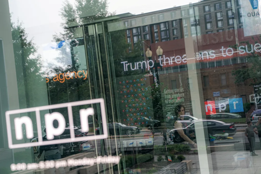 Reflection of the Washington D.C. NPR headquarters and a 