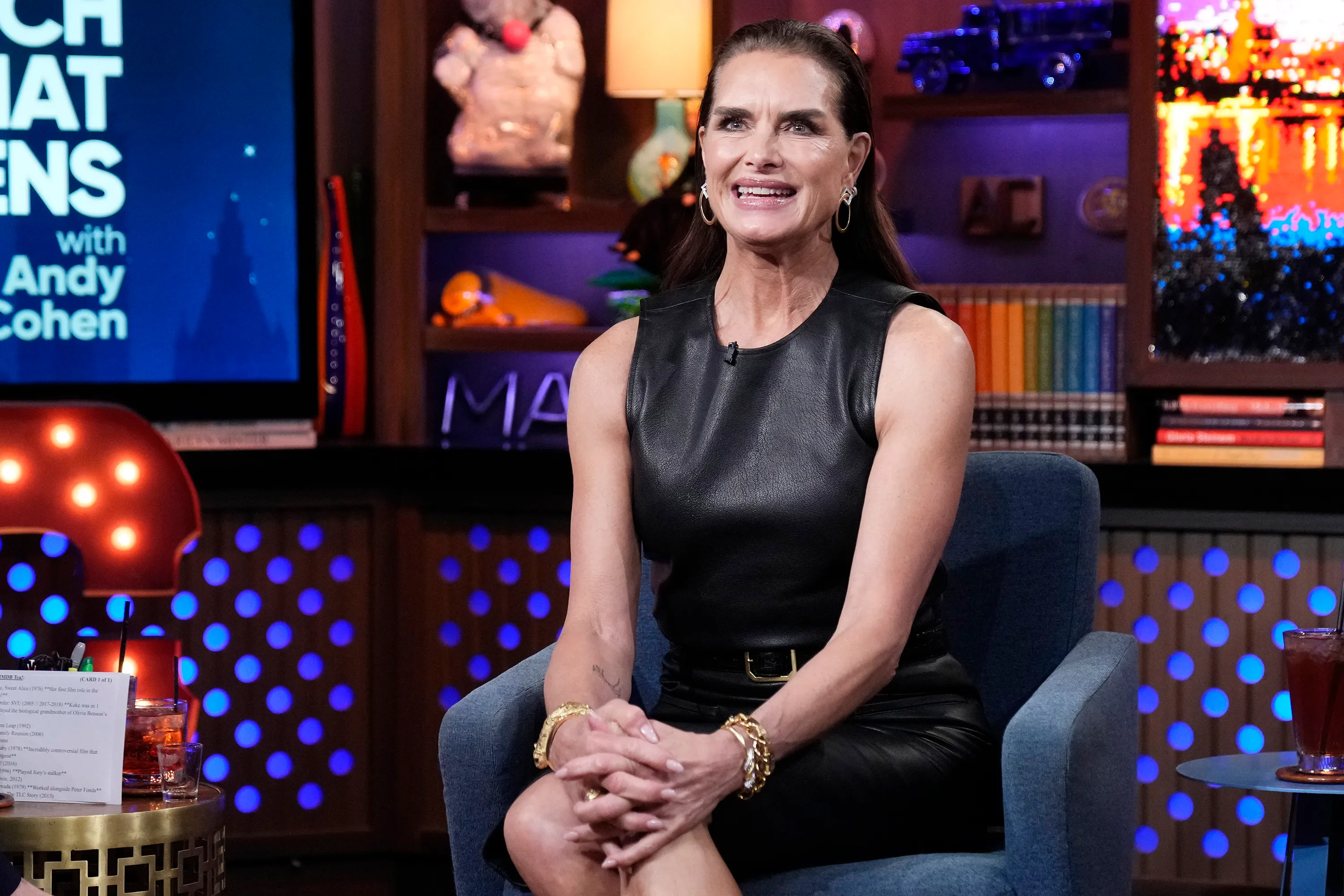Brooke Shields seated on the set of 