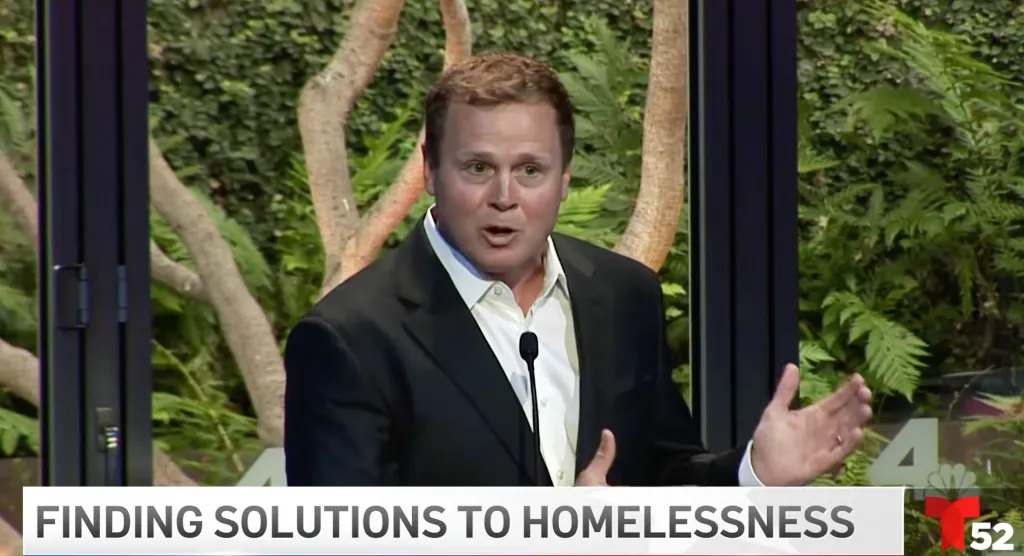 Spencer Pratt speaking at a debate about homelessness solutions.