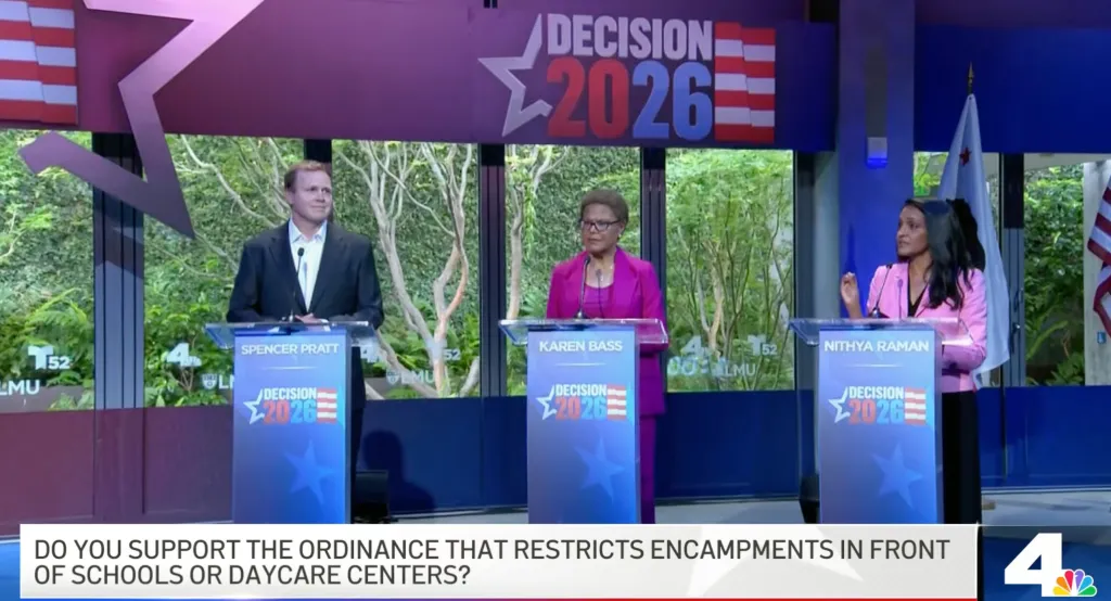 Three people, Spencer Pratt, Karen Bass, and Nithya Raman, standing at podiums during a debate.