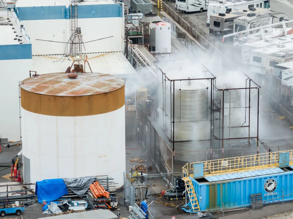 Water is sprayed on a damaged chemical tank at GKN Aerospace.