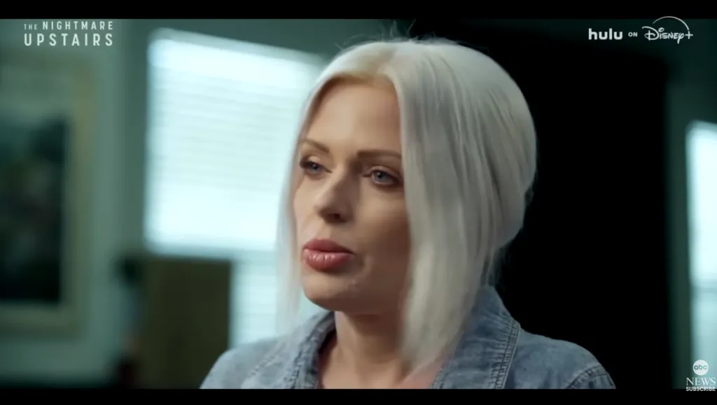 Woman with blonde hair wearing a denim jacket.