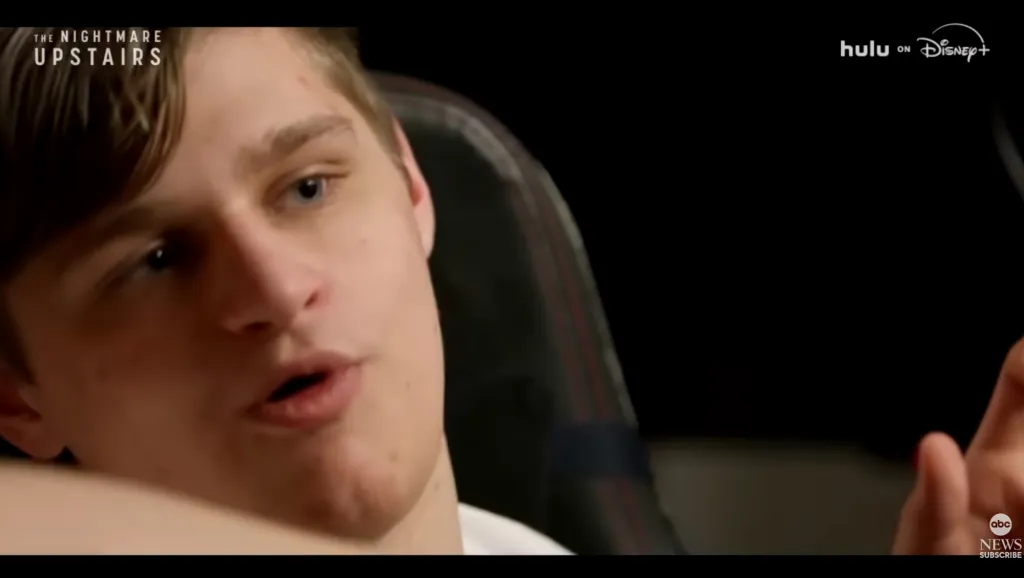 A young man with light hair and blue eyes, Brynlee Larson, speaking to the camera in 