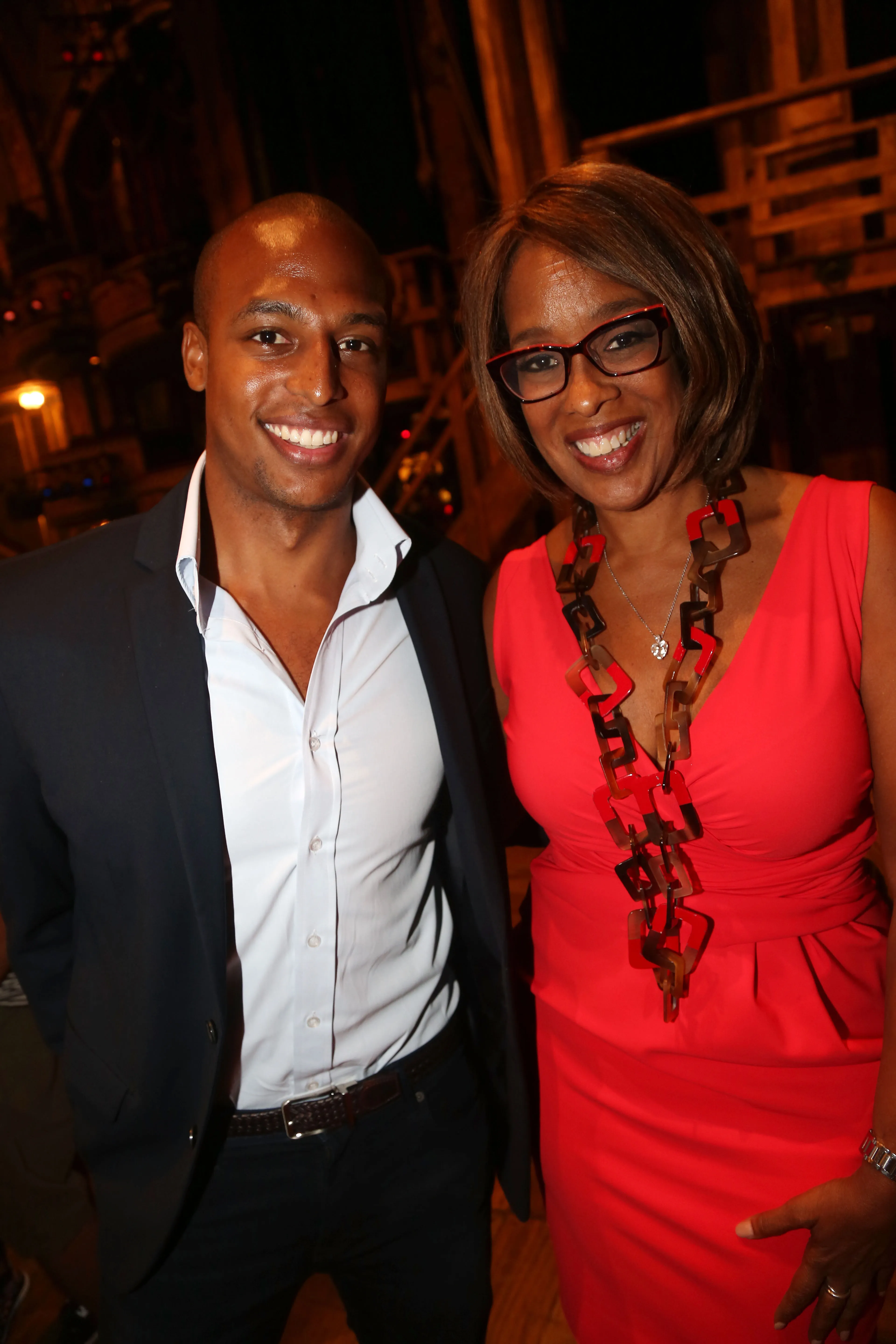 William Bumpus Jr. and Gayle King smile for a photo.