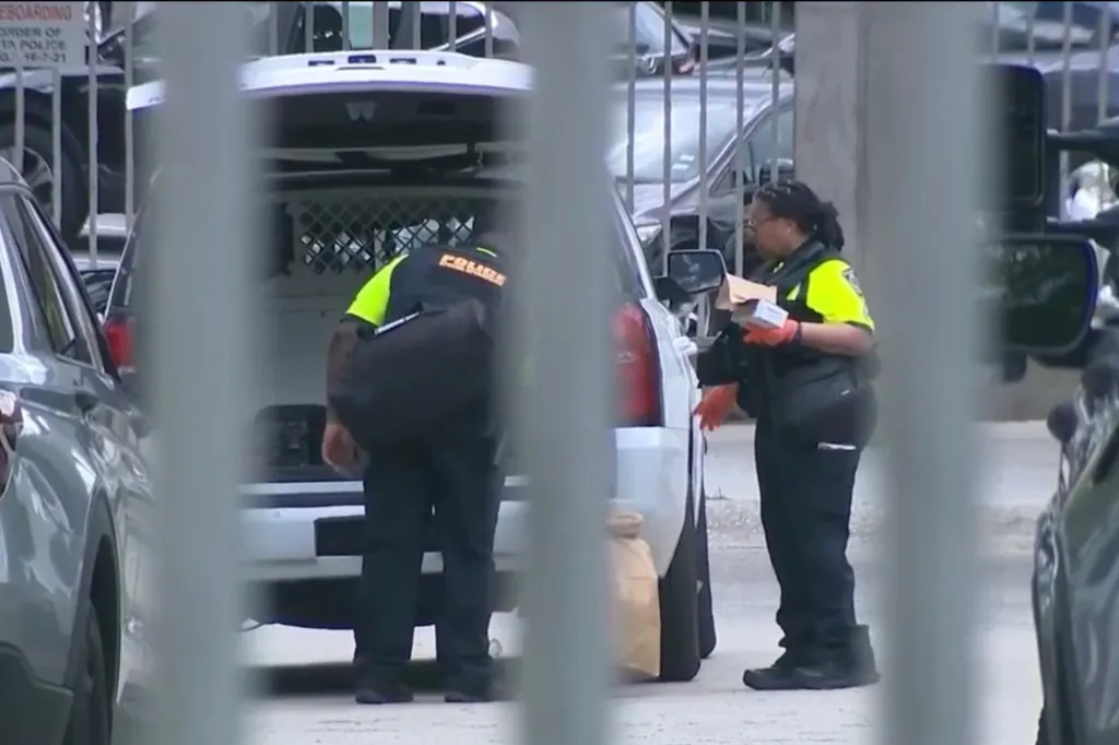 Police load evidence into a car after the deadly stabbing on May 30, 2026.