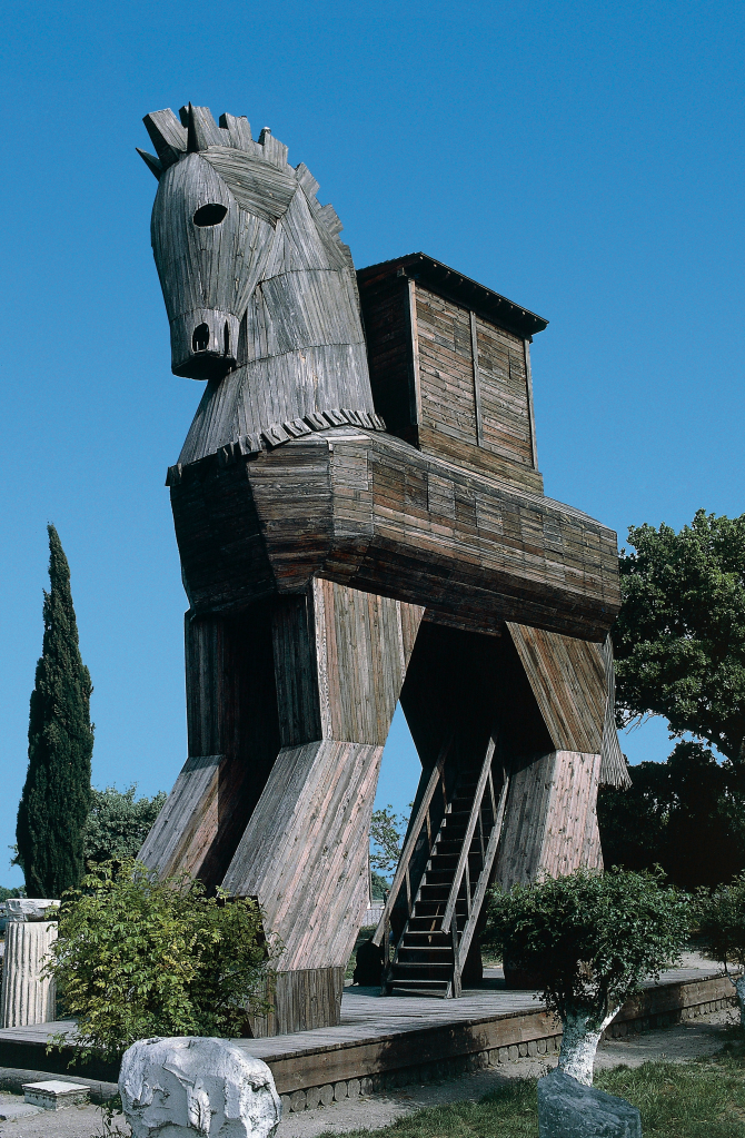 A large wooden Trojan Horse replica at Hisarlik, Turkey, with a wooden staircase leading up into its belly.