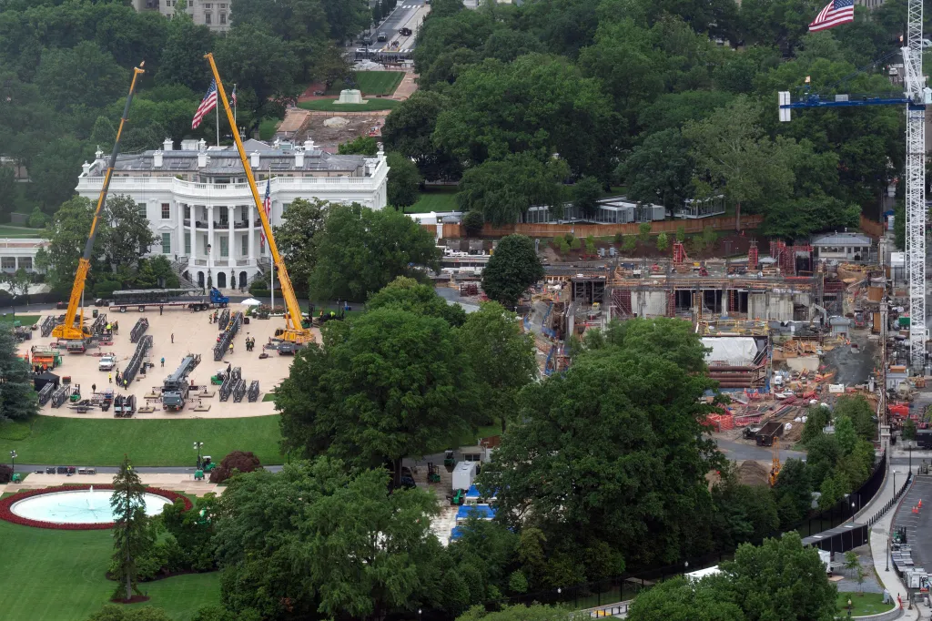 Work continues on the construction of the ballroom at the White House and a UFC cage on the South Lawn.