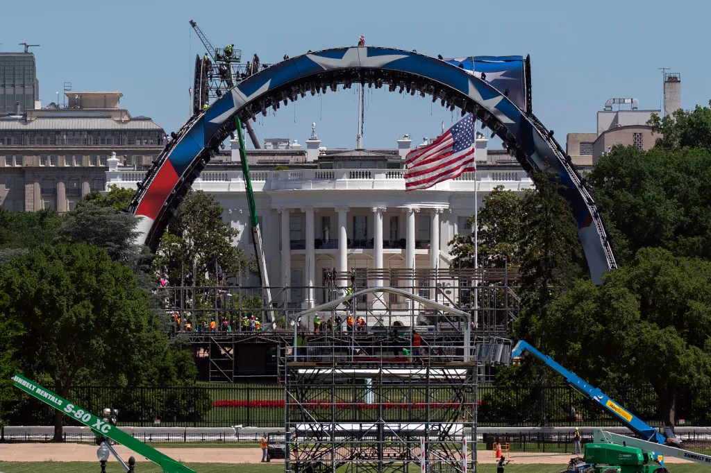 Workers build a UFC cage on the South Lawn in front of the White House.