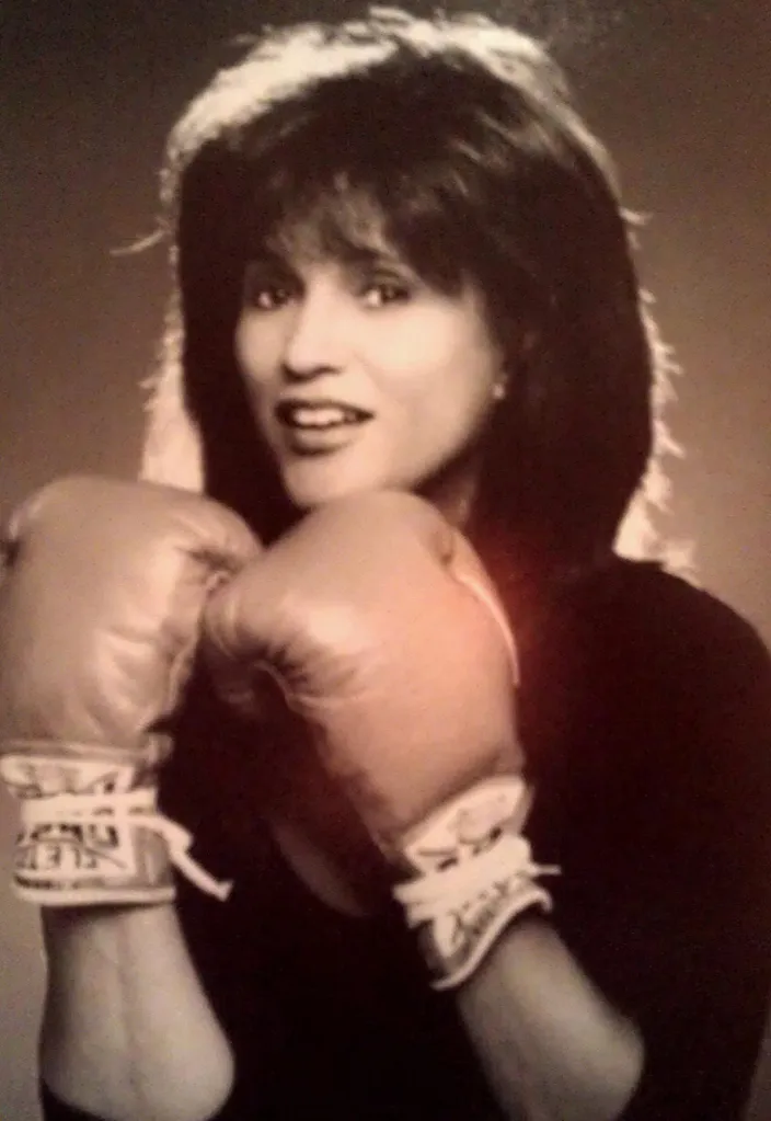 Gwen Farrell wearing boxing gloves.