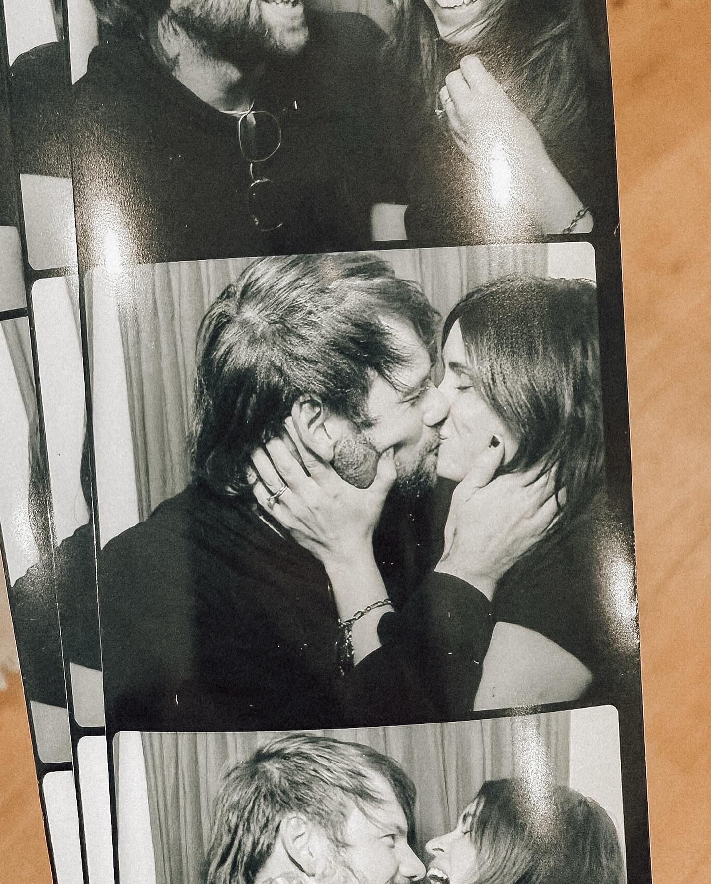 A black and white photo booth strip shows Caleb Shomo and his wife in three different poses, embracing and kissing.