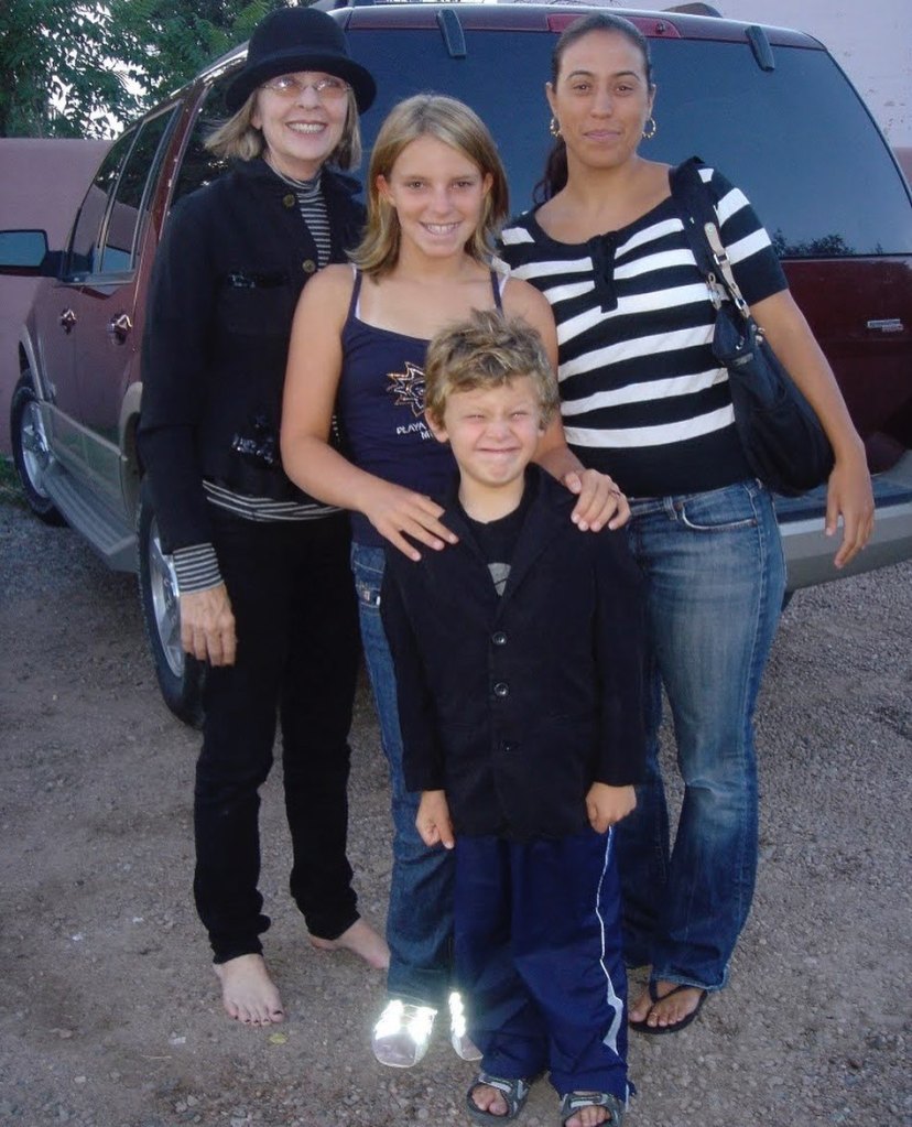 Actress Diane Keaton posing with her daughter Dexter and two other people.