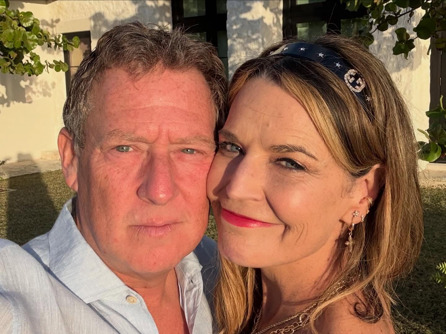 Savannah Guthrie and Michael Feldman posing together.