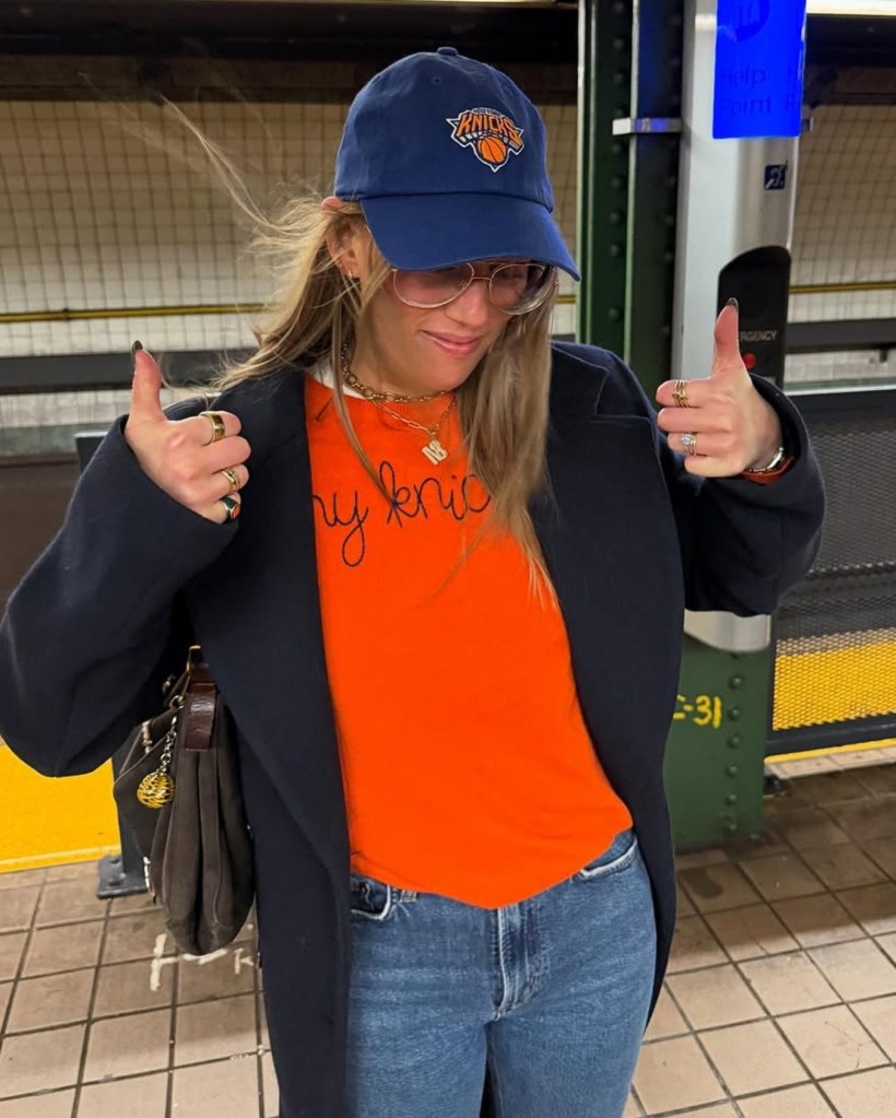 A young woman wearing an orange 
