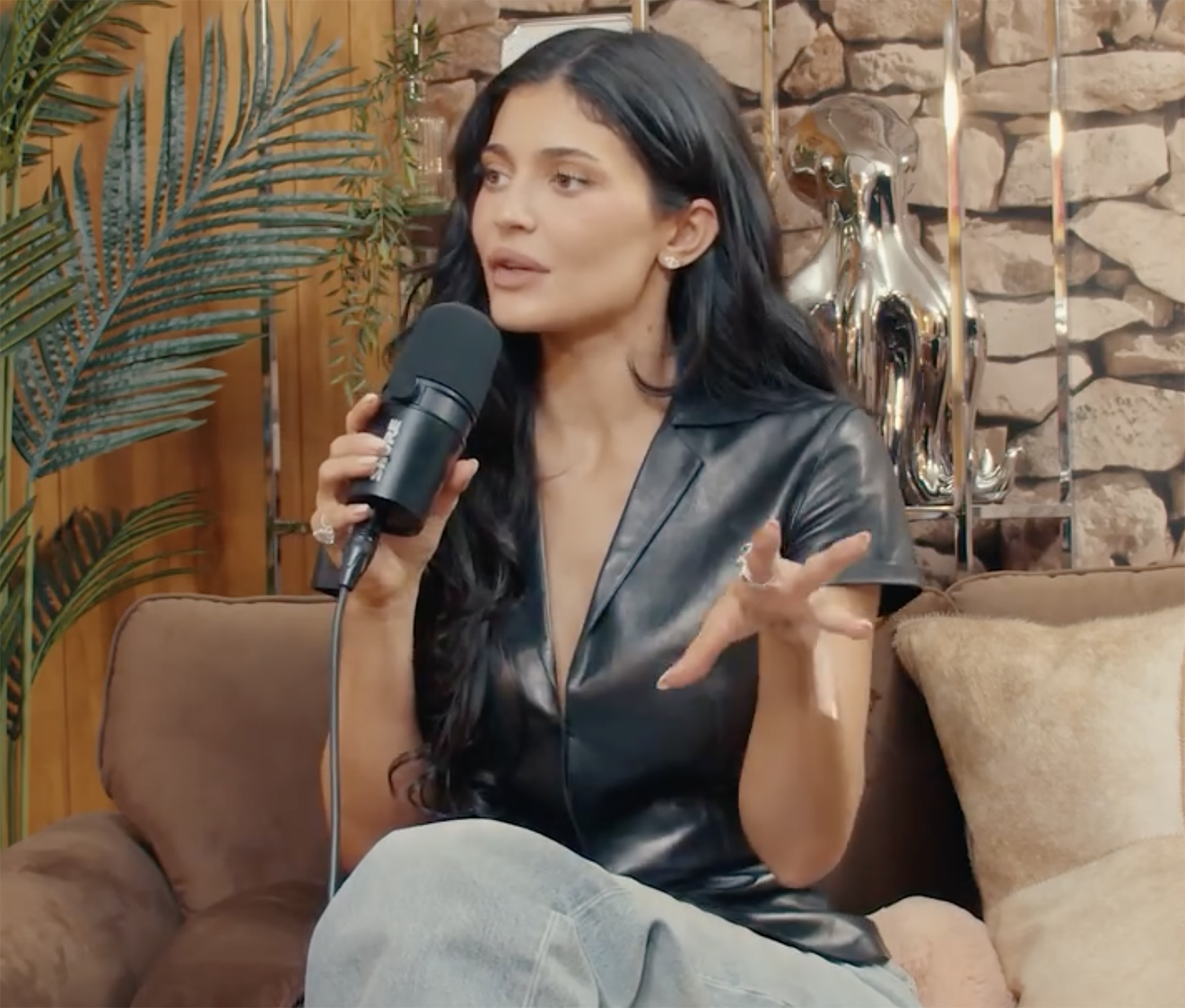 Kylie Jenner speaking into a microphone.
